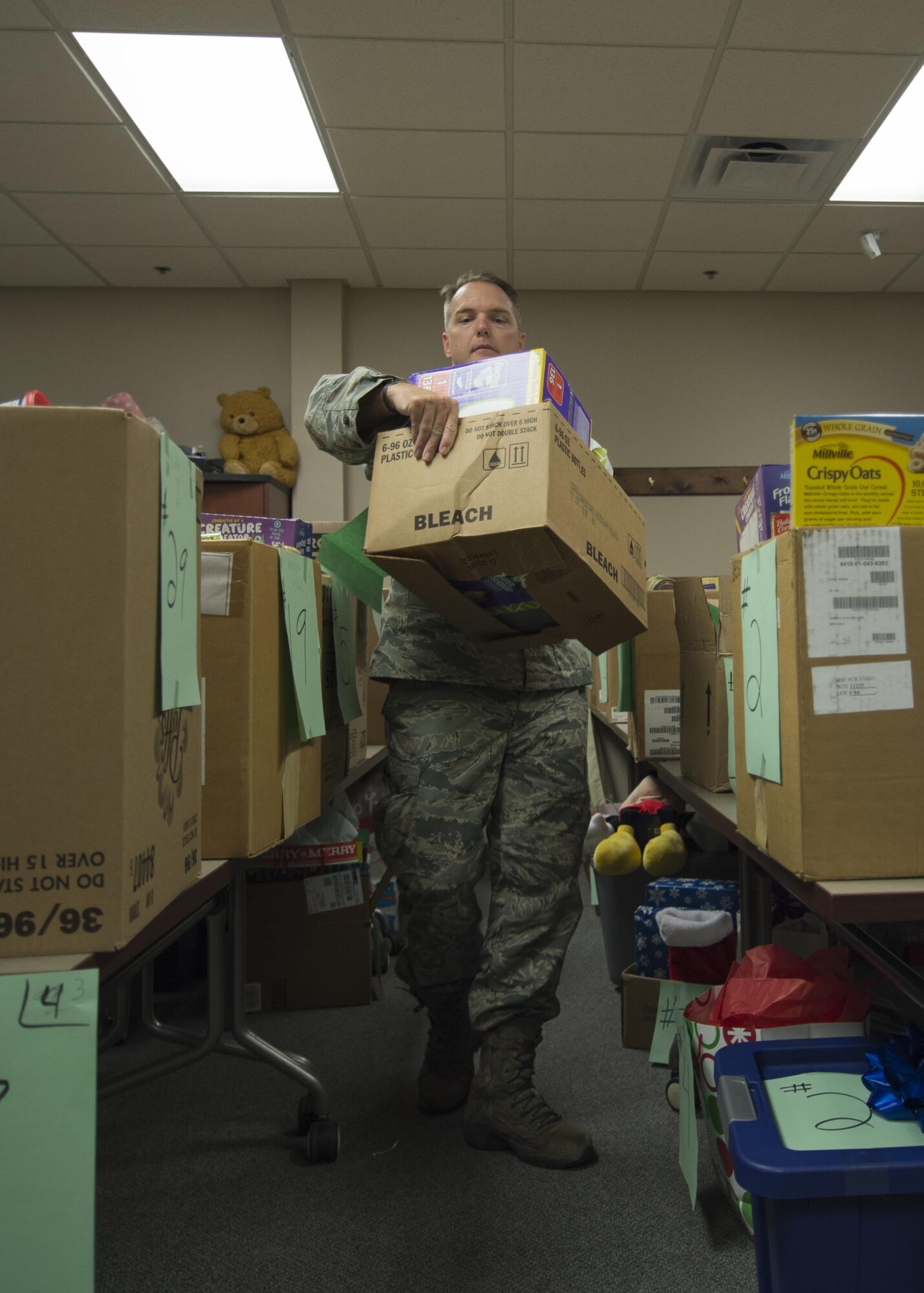 Tech Sgt. Daniel Huff, 434th Force Support Squadron readiness technician, gathers donations for a one of the Angel Tree recipients at Grissom Air Reserve Base, Ind. on December 3, 2017. Huff said that this year the Angel Tree received more donations than he has seen since he began working on with the program three years ago. (U.S. Air Force photo/Staff Sgt. Dakota Bergl)