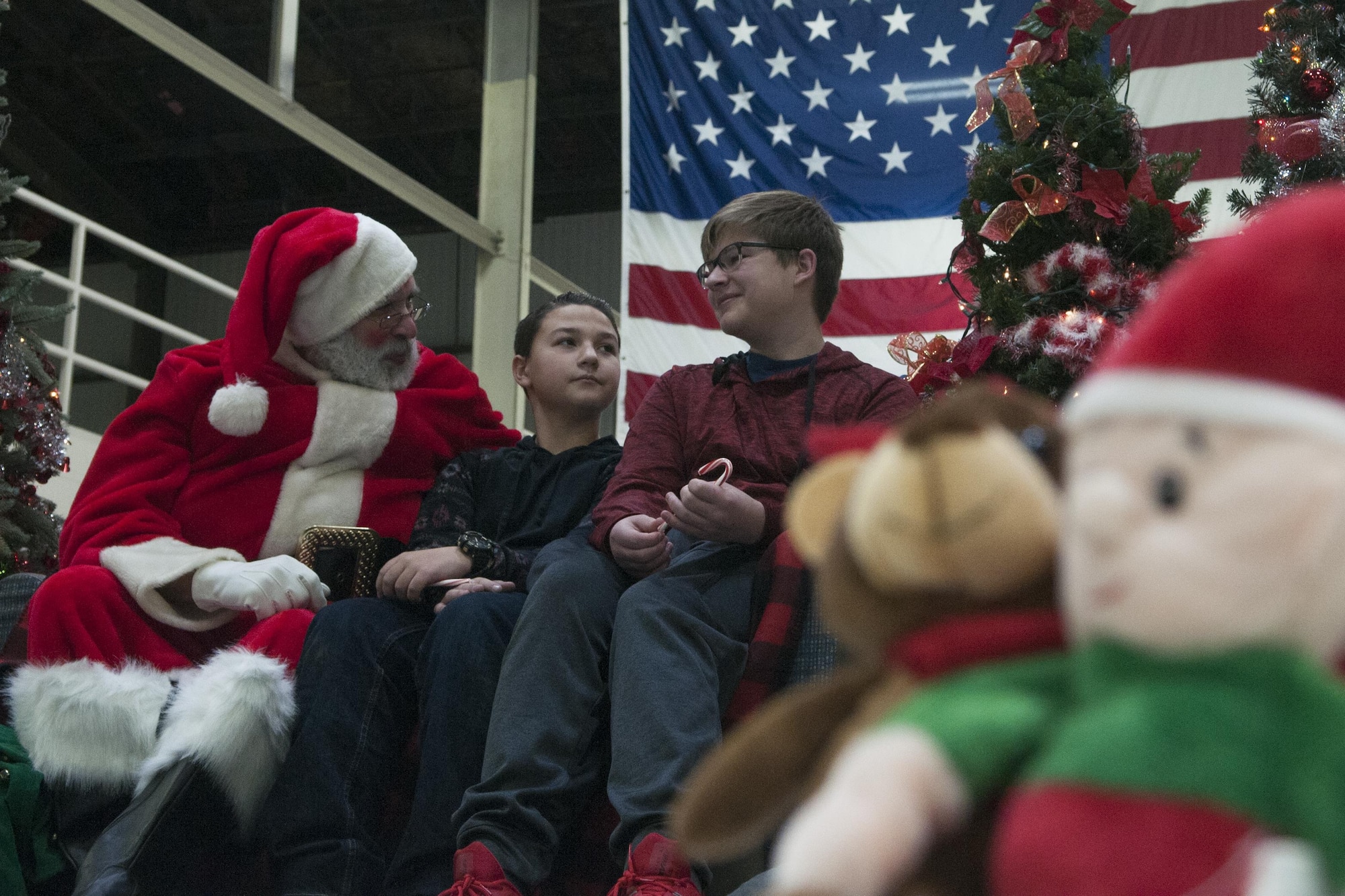 Two boys talk to Santa during the annual Christmas party at Grissom Air Reserve Base, Ind. on Dec 2, 2017. The party featured a visit from Santa, cookie decorating, a crafts table and a place to get family photos taken. (U.S. Air Force photo/Staff Sgt. Dakota Bergl)