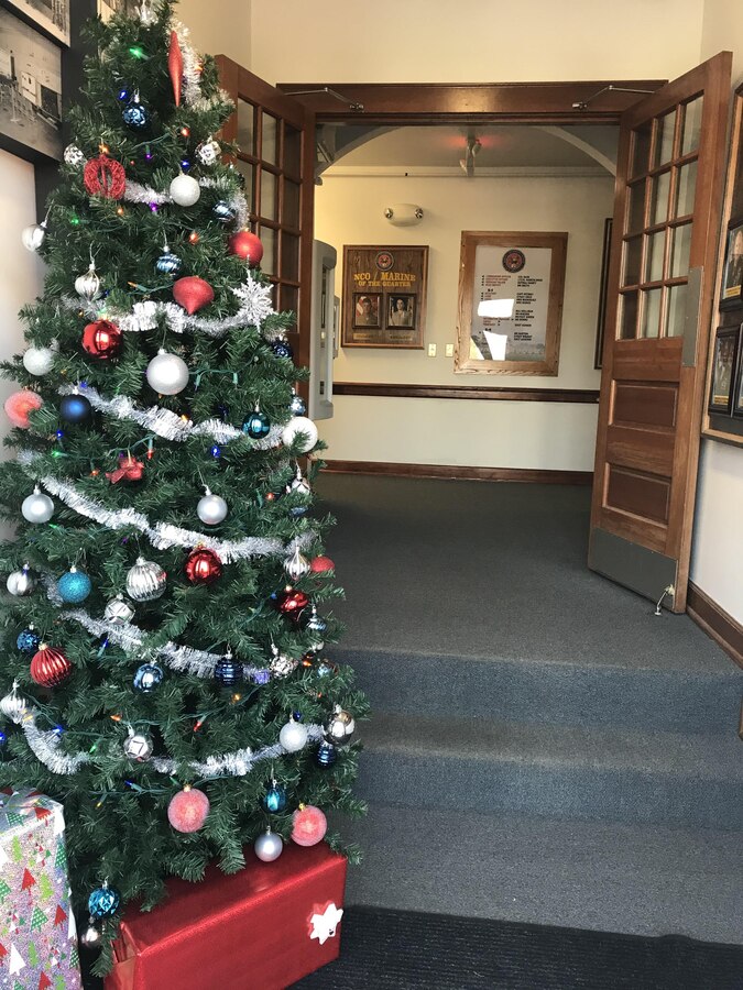 Marine Corps Engineer School (MCES) spouses placed decorations around the headquarters building for the upcoming holiday season on December 1, 2017.