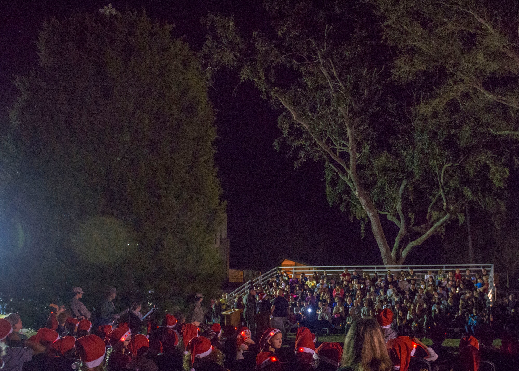 Eglin families line the bleachers around the base Christmas tree for the annual lighting ceremony Nov. 30 at Eglin Air Force Base, Fla.