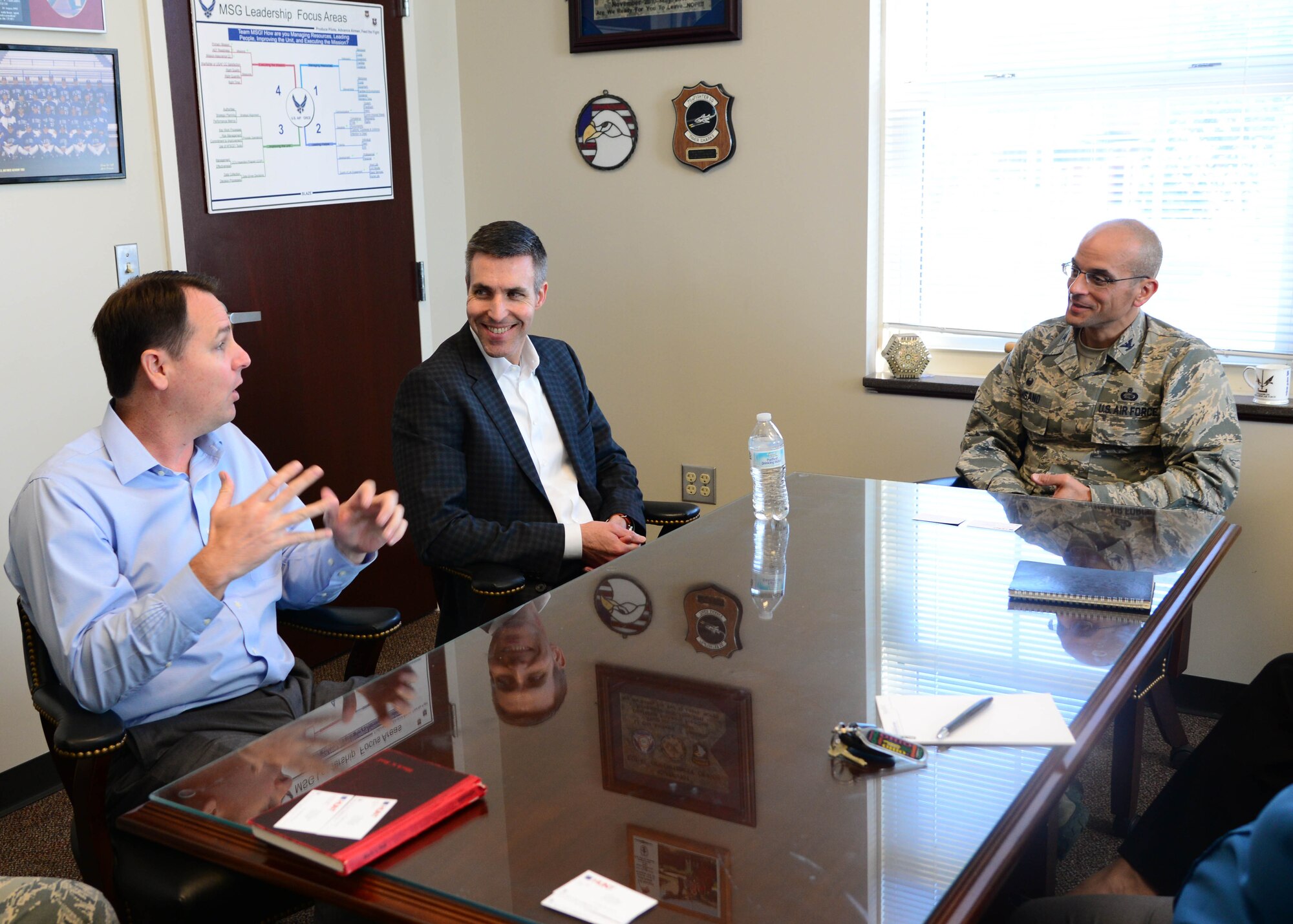 Greg Raap, Hunt Companies Vice President, and John Ehle, Hunt Companies President, talk with Col. Anthony Sansano, 14th Mission Support Group Commander, Nov. 28, 2017, on Columbus Air Force Base, Mississippi. Ehle and Raap were here to receive feedback, check on the local Hunt Companies branch and establish a working relationship with Columbus AFB leadership. (U.S. Air Force photo by Airman 1st Class Beaux Hebert)