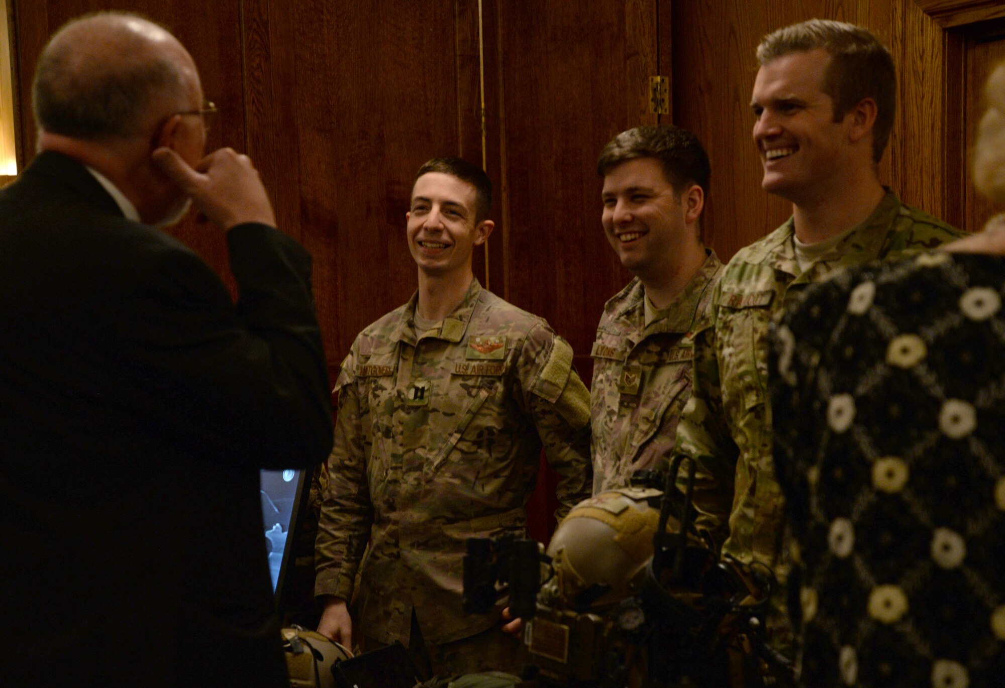 U.S. Airmen assigned to the 352d Special Operations Wing converse with guests of the Yuletide reception Dec. 1, 2017, hosted on RAF Mildenhall, England. Prior to opening remarks, Airmen spoke to guests about their wing’s mission and their experience living in England. (U.S. Air Force photo by Senior Airman Justine Rho)