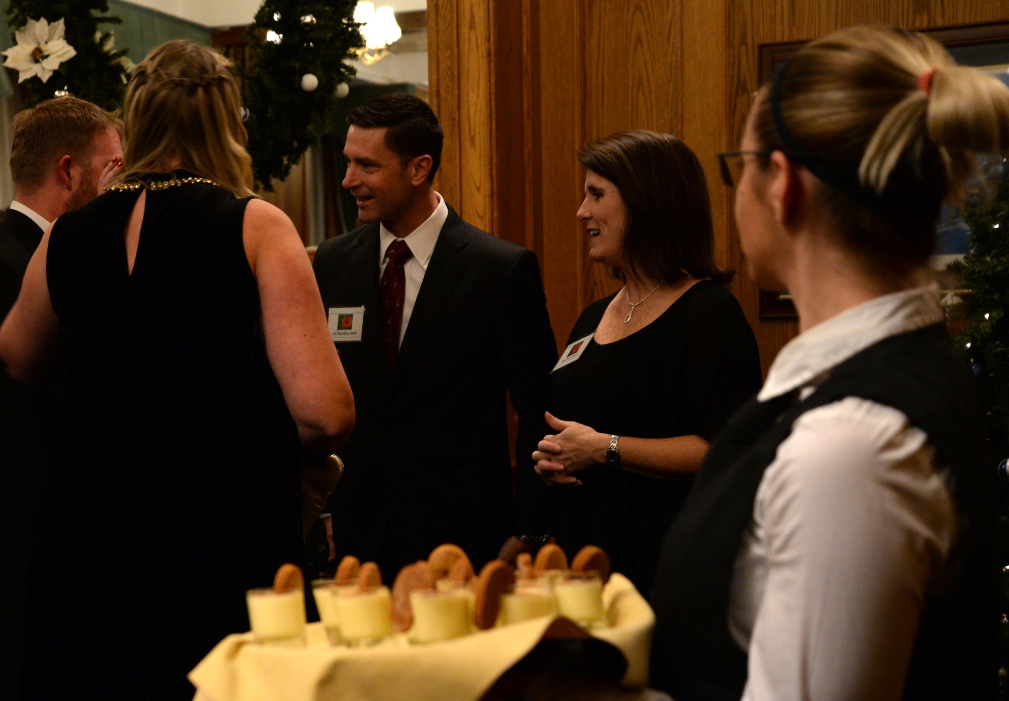 U.S. Air Force Col. Matthew Smith, 352d Special Operations Wing commander, greets guests at the Yuletide reception Dec. 1, 2017, hosted on RAF Mildenhall, England. Previous to meeting the commander, guests had the opportunity to speak with Airmen and learn about the missions of the 100th ARW, the 352d Special Operations Wing and the 48th Fighter Wing. (U.S. Air Force photo by Senior Airman Justine Rho)