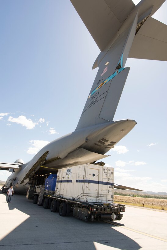 Cargo is unloaded from a military aircraft.