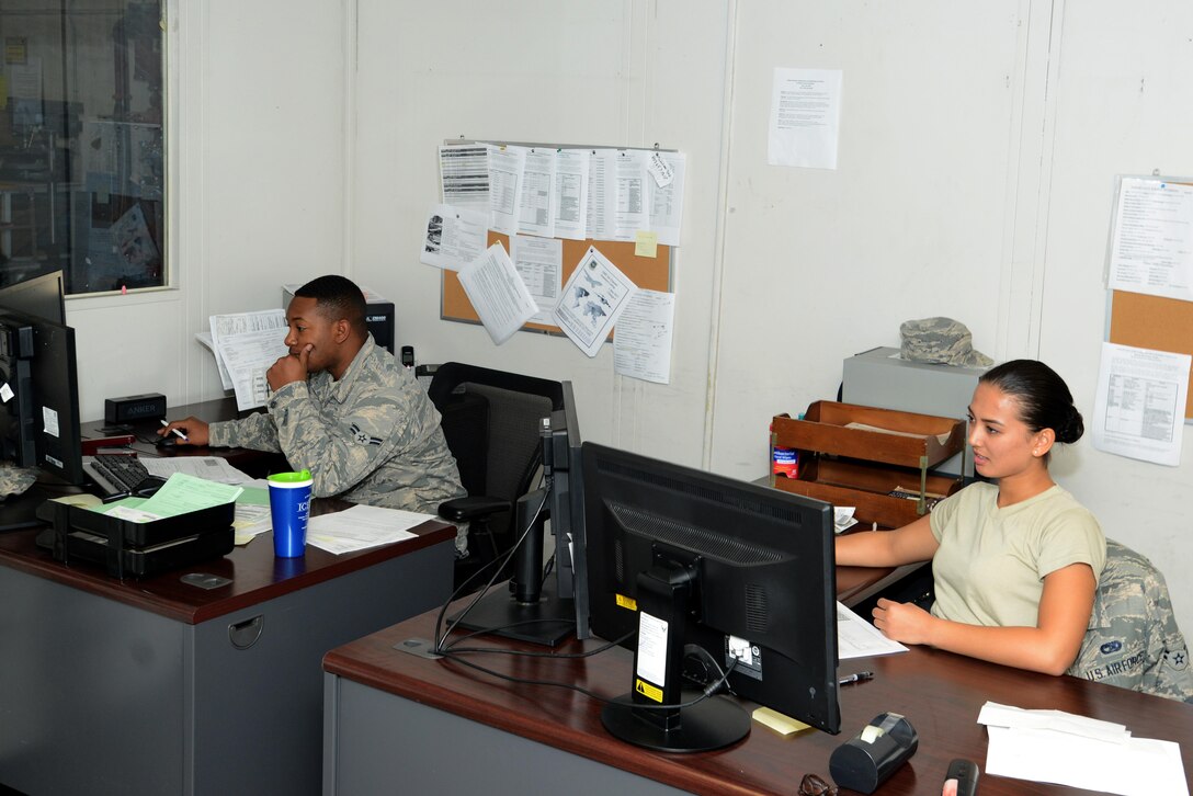 U.S. Air Force Airman 1st Class Rahkeem Fair, left, and Airman 1st Class Kaila Allen, right, 20th Logistics Readiness Squadron (LRS) outbound cargo specialists, track outgoing cargo at Shaw Air Force Base, South Carolina, Nov. 29, 2017.