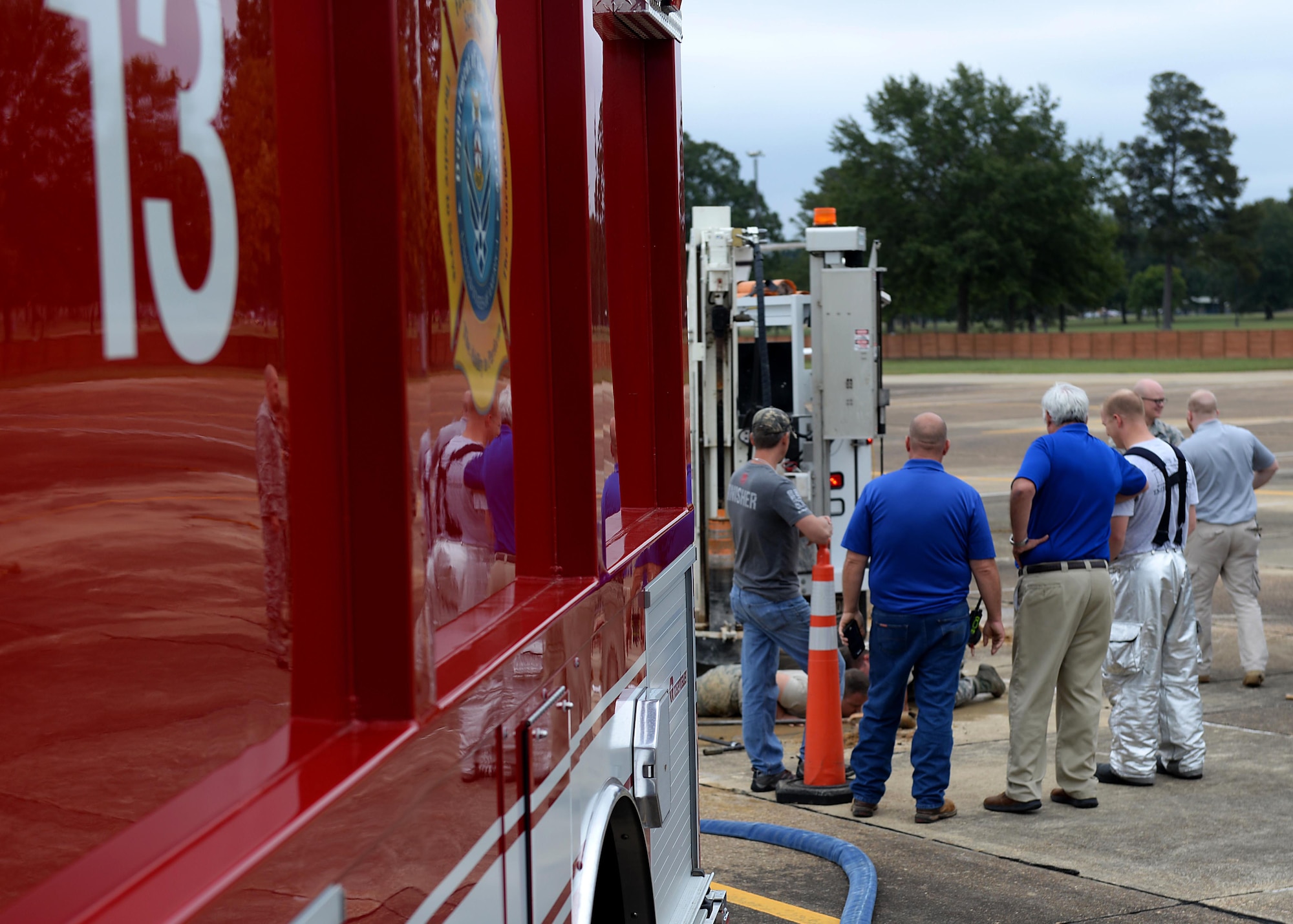 Members of the 14th Civil Engineer Squadron, 14th Operations Support Squadron and Air Force Civil Engineer Center Airfield and Pavement Evaluation Team survey a hole on the airfield at Columbus Air Force Base, Mississippi, Oct. 11, 2017. Gary Wright, 14th Flying Training Wing Airfield Manager, was walking along the T-1A Jayhawks parking/taxiway and identified a hole that looked suspicious. The APE Team was able to survey and begin repairing the issue immediately. (U.S. Air Force photo by Airman 1st Class Keith Holcomb)