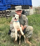 New York Army National Guard Spc. Stefani DeManincor, a member of the 105th Military Police Company, with Ava, the stray dog she adopted during a deployment to the U.S. Virgin Islands.