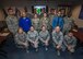 Command chief poses with Dec UTA newcomers class.