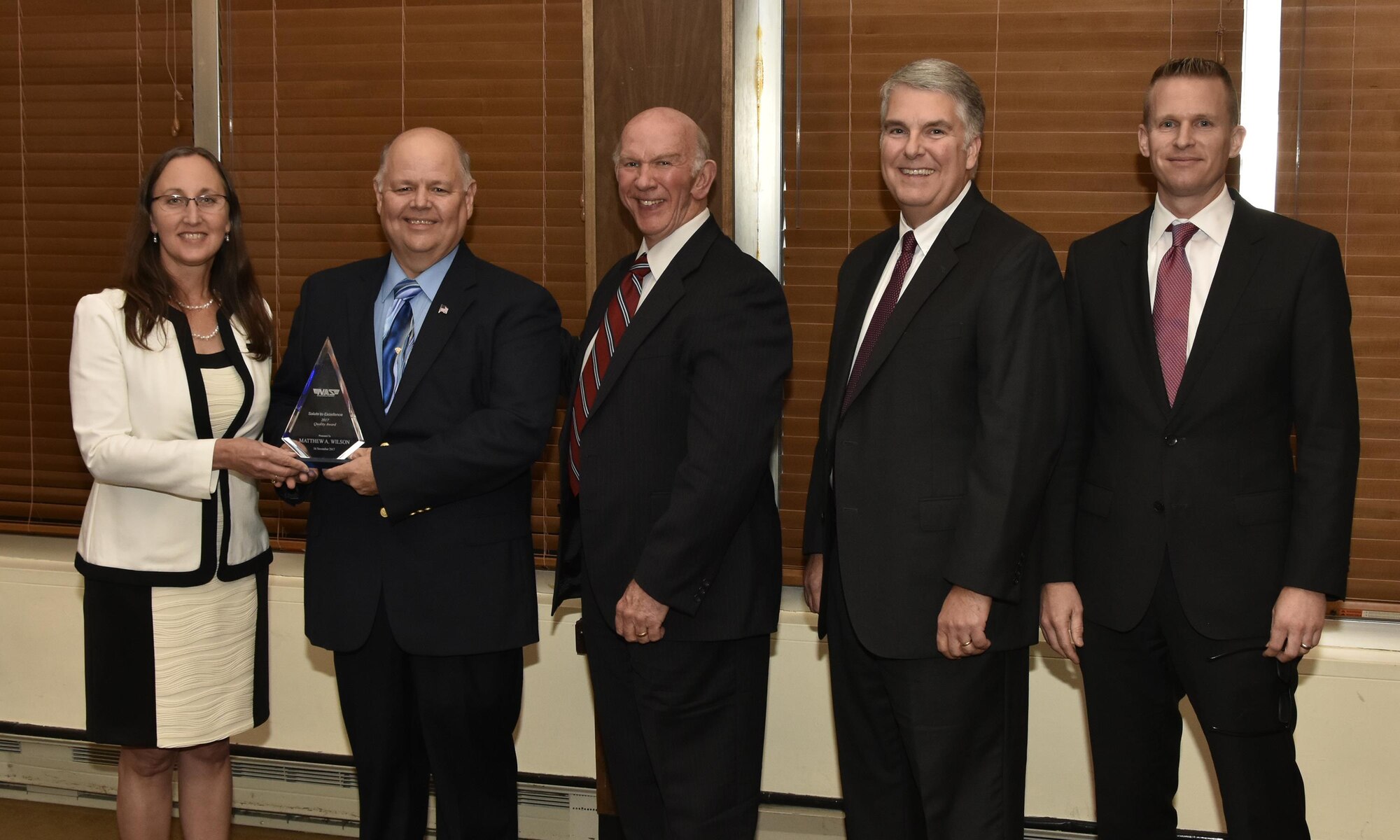 Matthew Wilson (second from left), NAS test operations quality specialist,  receives the Quality Award from NAS General Manager Cynthia Rivera during the National Aerospace Solutions 2017 Salute to Excellence Annual Awards Banquet held Nov. 16 at the Arnold Lakeside Center, Arnold AFB, Tenn.. Also pictured is NAS Deputy General Manager Doug Pearson, NAS Test and Sustainment Engineering Manager Jeff Henderson and NAS Integrated Resources Director Ben Souther. (U.S. Air Force photo/Rick Goodfriend)