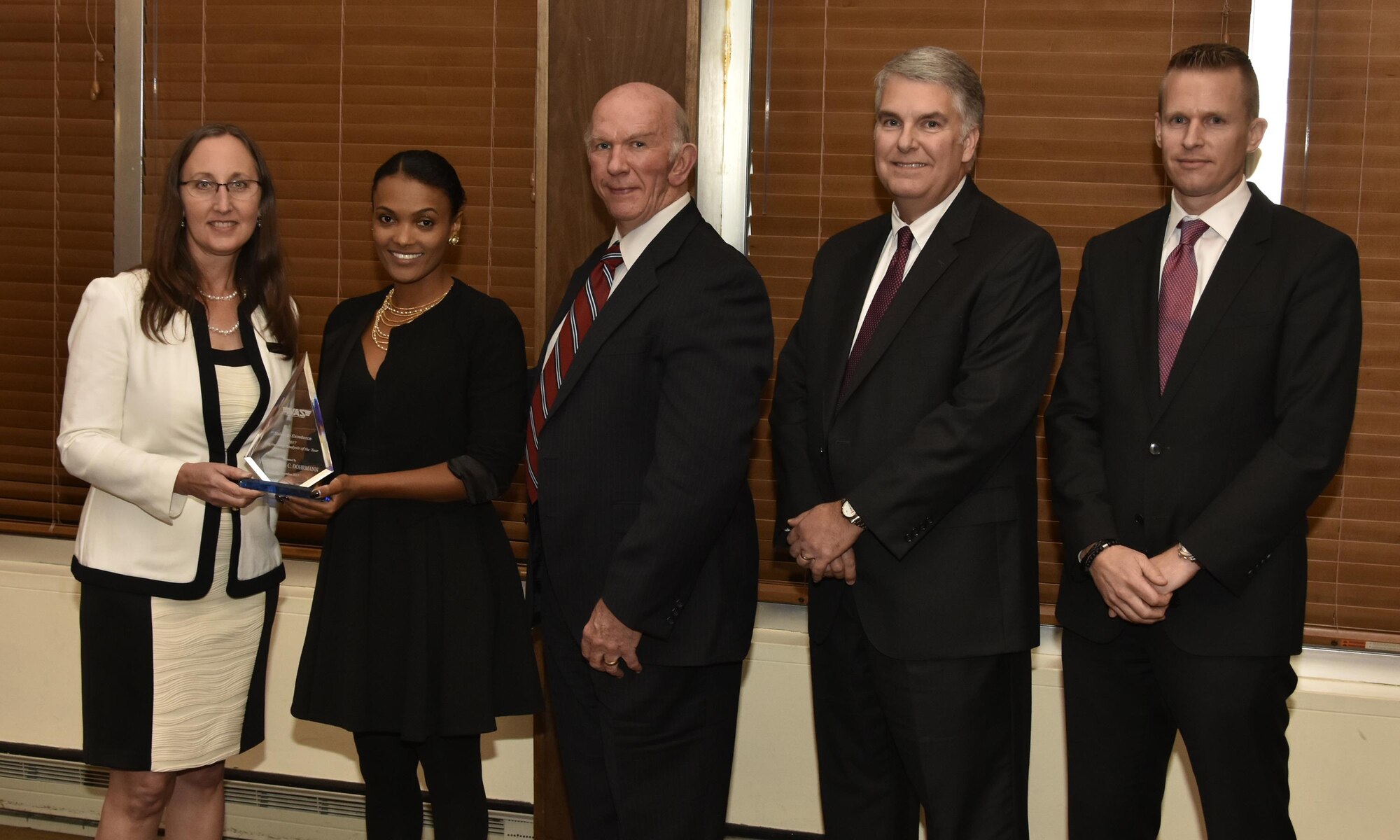 Yeshiemebe Dohrmann (second from left), NAS mechanical design engineer, receives the Engineering Analysis of the Year Award from NAS General Manager Cynthia Rivera during the National Aerospace Solutions 2017 Salute to Excellence Annual Awards Banquet held Nov. 16 at the Arnold Lakeside Center, Arnold AFB. Also pictured is NAS Deputy General Manager Doug Pearson, NAS Test and Sustainment Engineering Manager Jeff Henderson, and NAS Integrated Resources Director Ben Souther. (U.S. Air Force photo/Rick Goodfriend)