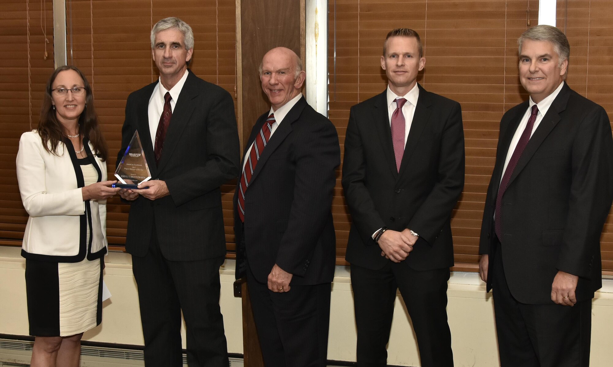 John Shuttleworth (second from left), Capital Project manager, receives the Project Manager of the Year Award from NAS General Manager Cynthia Rivera during the National Aerospace Solutions 2017 Salute to Excellence Annual Awards Banquet held Nov. 16 at the Arnold Lakeside Center, Arnold AFB. Also pictured is NAS Deputy General Manager Doug Pearson, NAS Integrated Resources Director Ben Souther and NAS Test and Sustainment Engineering Manager Jeff Henderson. (U.S. Air Force photo/Rick Goodfriend)
