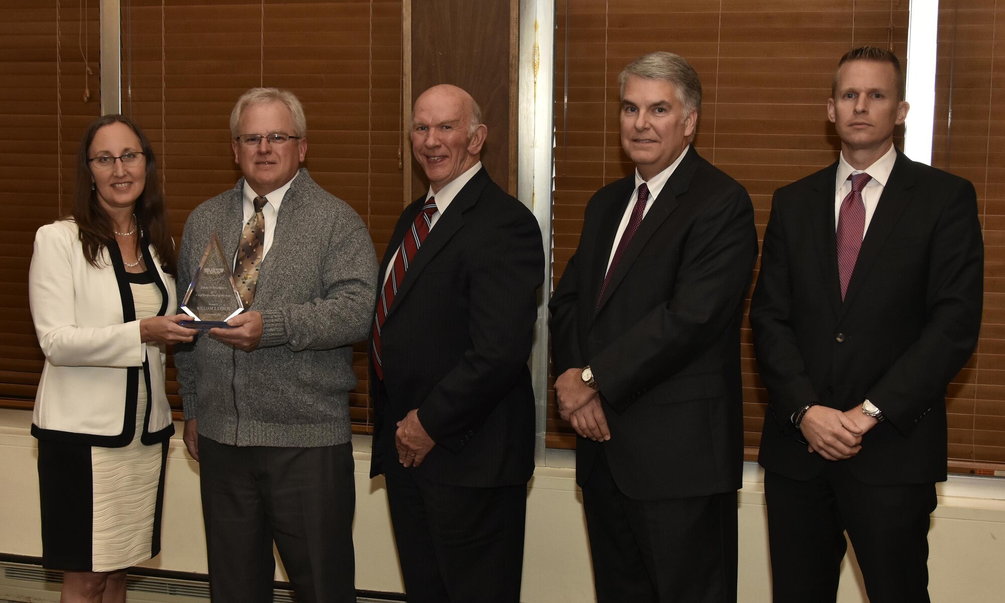 William Lynch (second from left), NAS lead machinist, receives the Craft Professional of the Year Award from NAS General Manager Cynthia Rivera during the National Aerospace Solutions 2017 Salute to Excellence Annual Awards Banquet held Nov. 16 at the Arnold Lakeside Center, Arnold AFB. Also pictured is NAS Deputy General Manager Doug Pearson, NAS Test and Sustainment Engineering Manager Jeff Henderson, and NAS Integrated Resources Director Ben Souther. (U.S. Air Force photo/Rick Goodfriend)