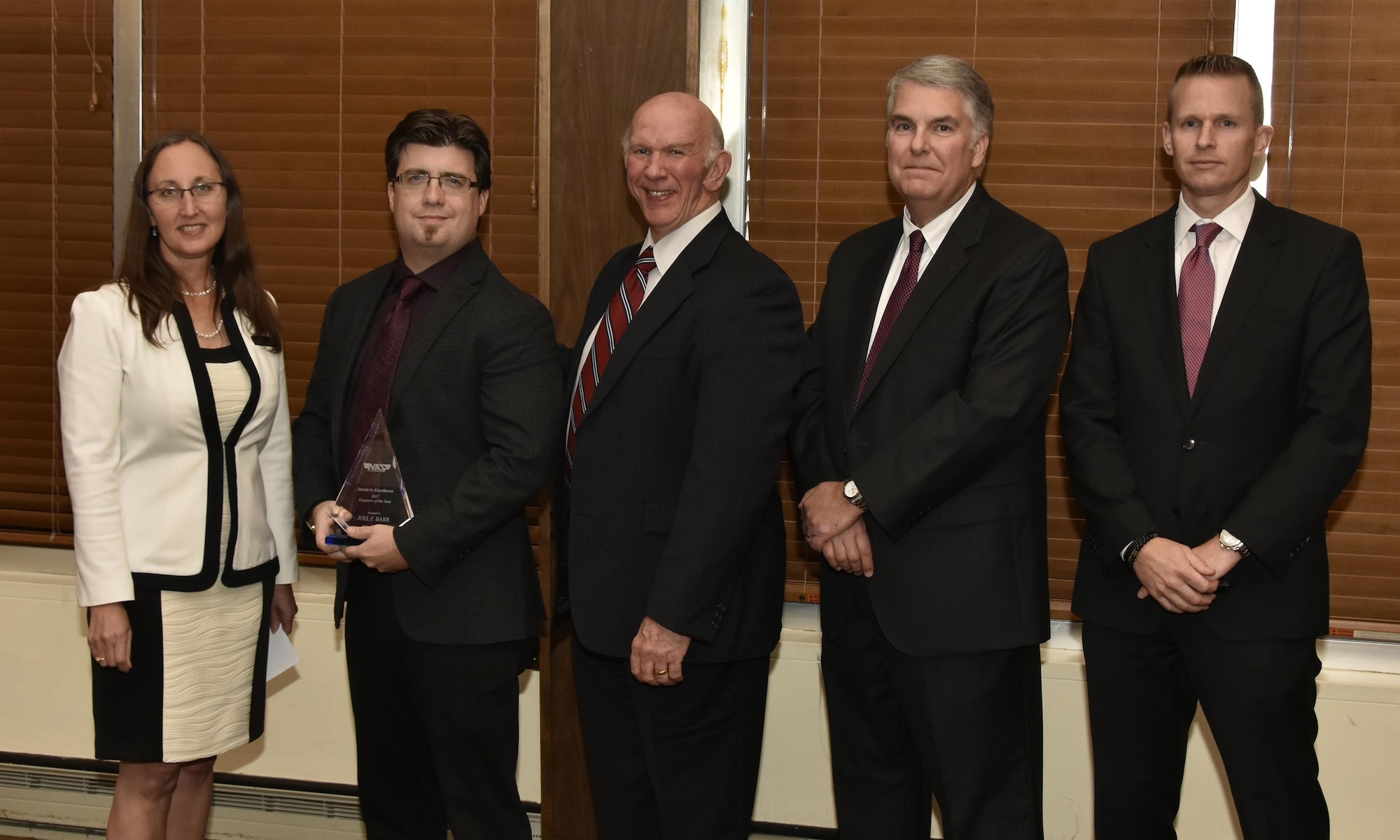 Joel Barr (second from left), NAS electrical engineer, receives the Engineer of the Year Award from NAS General Manager Cynthia Rivera during the National Aerospace Solutions 2017 Salute to Excellence Annual Awards Banquet held Nov. 16 at the Arnold Lakeside Center, Arnold AFB. Also pictured is NAS Deputy General Manager Doug Pearson, NAS Test and Sustainment Engineering Manager Jeff Henderson and NAS Integrated Resources Director Ben Souther. (U.S. Air Force photo/Rick Goodfriend)