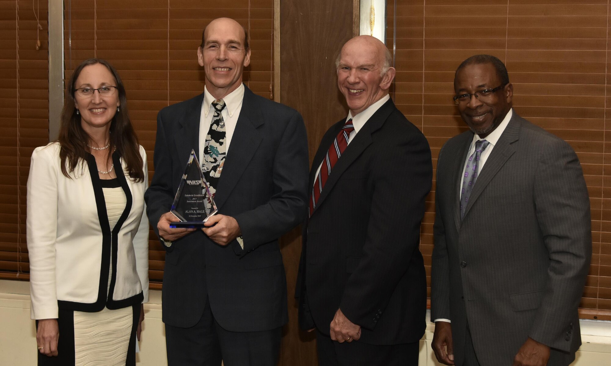 Dr. Alan Hale (second from left), NAS Model & Simulation engineer, receives the Innovation Award from NAS General Manager Cynthia Rivera during the National Aerospace Solutions 2017 Salute to Excellence Annual Awards Banquet Nov. 16 at the Arnold Lakeside Center, Arnold AFB. Also pictured is NAS Deputy General Manager Doug Pearson and NAS Technical Director Woodrow Whitlow. (U.S. Air Force photo/Rick Goodfriend)