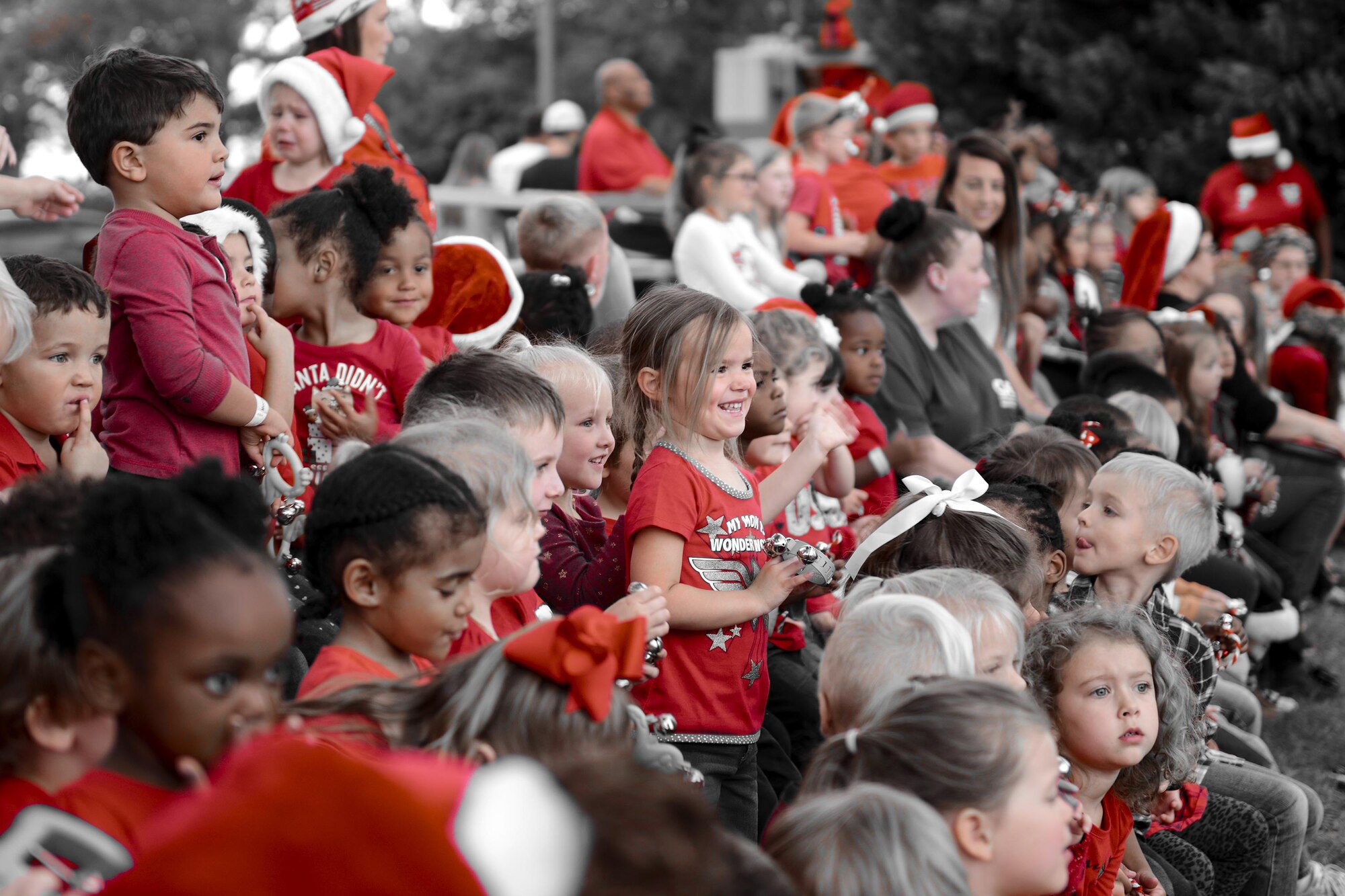 Children from the Child Development Center get ready to sing during the Tree Lighting Ceremony, Dec. 1, 2017, at Moody Air Force Base, Ga. The annual event brings the base community together as a way to show thanks for their continuous sacrifice and celebrate the holiday season. The celebration included a parade, raffle give-a-ways, children’s activities and traditional lighting of the base Christmas tree by families of deployed Airmen. (U.S. Air Force photo illustration by Airman 1st Class Erick Requadt)