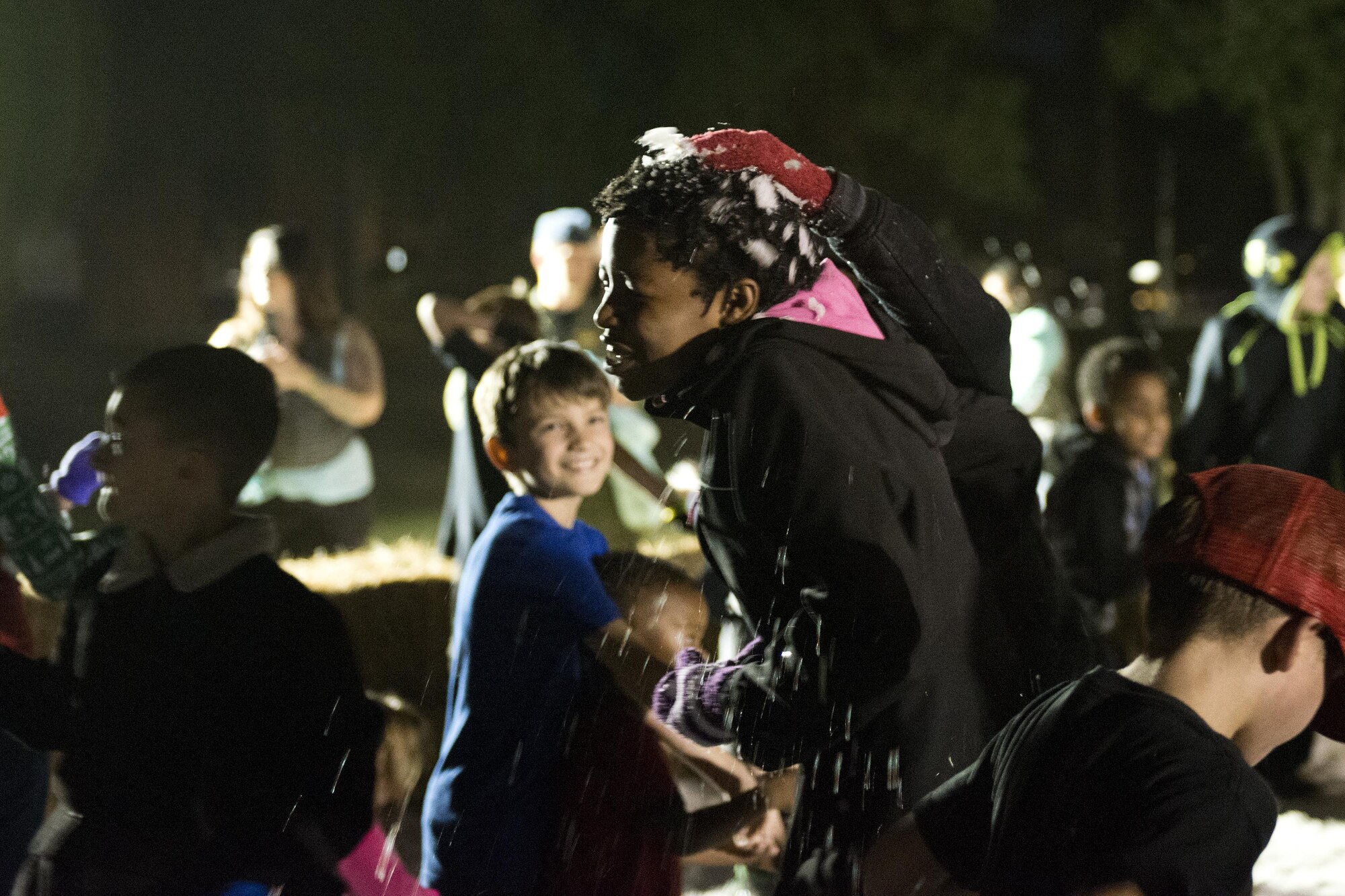 Children play in the snowball pit during the Tree Lighting Ceremony, Dec. 1, 2017, at Moody Air Force Base, Ga. The annual event brings the base community together as a way to show thanks for their continuous sacrifice and celebrate the holiday season. The celebration included a parade, raffle give-a-ways, children’s activities and traditional lighting of the base Christmas tree by families of deployed Airmen. (U.S. Air Force photo by Airman 1st Class Erick Requadt)