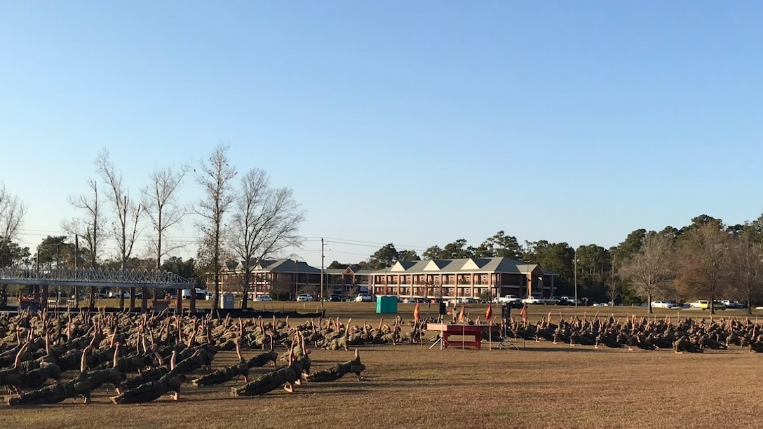 As part of the school physical training session on December 1, 2017 Gunnery Sergeant Lloyd Crabtree, the Force Fitness Instructor (FFI) for Marine Corps Engineer School; leads permanent personnel and students through a modified circuit course. In between each exercise the Marines were afforded time to “rest” in various plank positions.