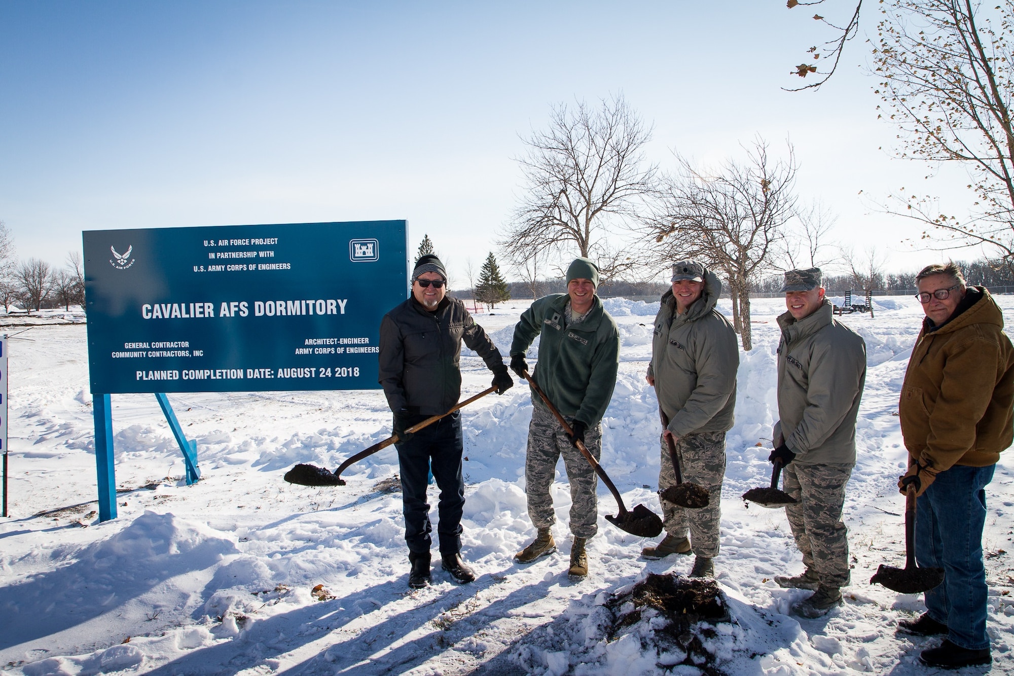 CAVALIER AIR FORCE STATION, N.D. -- Participating in the ground breaking ceremony for the new, $3 million dormitories, Nov. 7, 2017 at Cavalier Air Force Station, N.D., from left-to-right, Craig Tweten, Community Contractors; Lt. Col. Marc Brock, 21st Operations Group deputy commander; Lt. Col. Stephen Hobbs, 10th Space Warning Squadron commander; Chief Master Sgt. David Pesch, 21st Operations Group command chief; and Mr. Bruce Johnson, Army Corps of Engineers. (U.S. Air Force photo by TSgt Wayne Gibson)