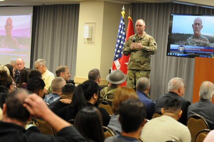 Major General Patrick J. Reinert, 88th Readiness Division commanding general, speaks to the more than 300 Soldiers and family members attending the Yellow Ribbon event in Minneapolis December 2.