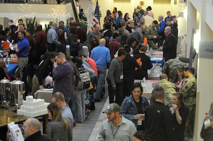 Soldiers and family members visit the community partners booths set up at the 88th Readiness Division-hosted Yellow Ribbon event in Minneapolis December 2.