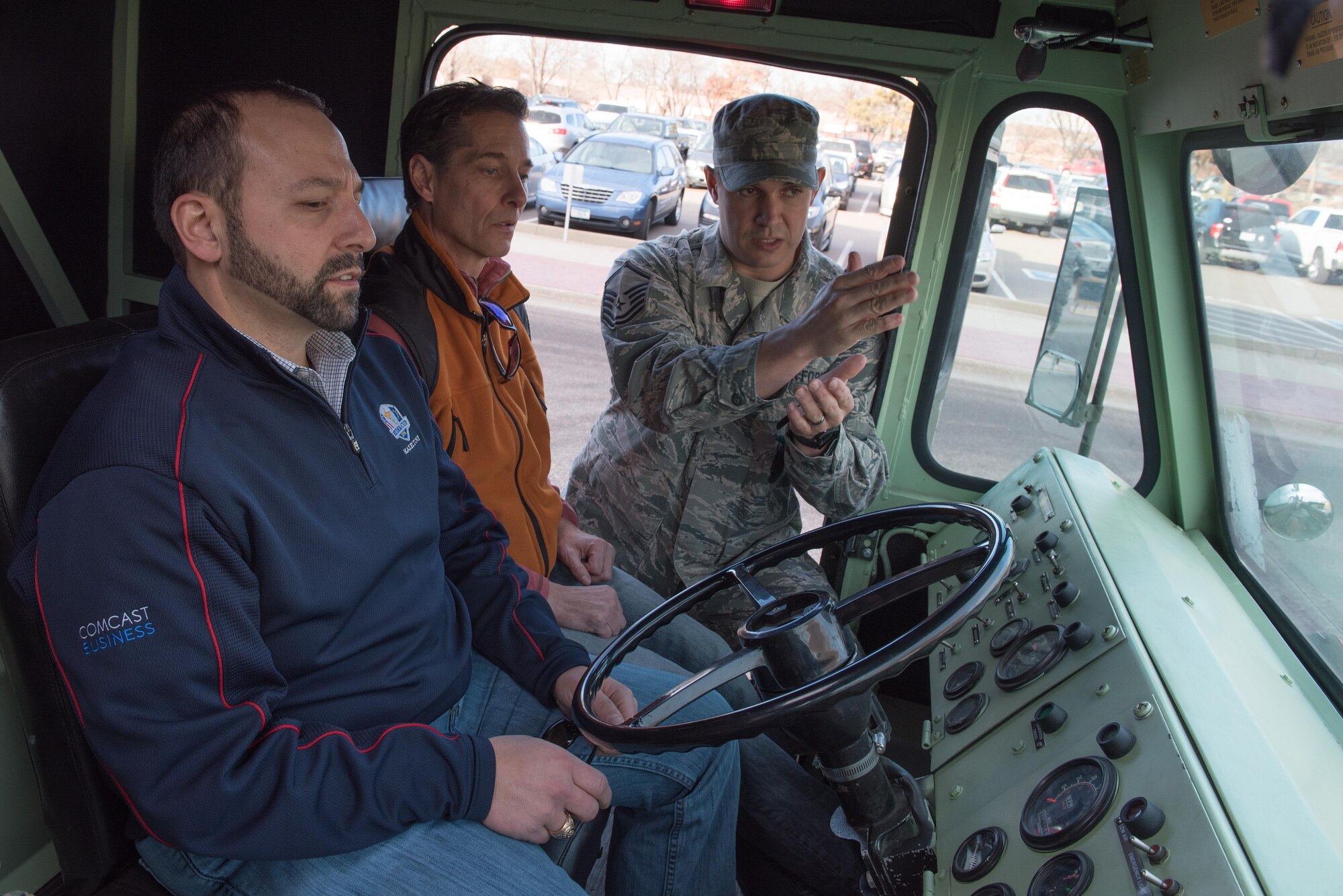 Master Sgt. Christopher Richardson, fire protection chief for the 934th Civil Engineering Squadron explains the capabilities of the Airport Rescue Fire Fighting (ARFF) vehicle at the Minneapolis-St. Paul Air Reserve Station, MN on Dec. 3, 2017.  The vehicle carries 6,100 gallons of water and 515 gallons of foam and is designed for all-weather operation at airfields for fire suppression.(U.S. Air Force photo by Master. Sgt. Eric Amidon)