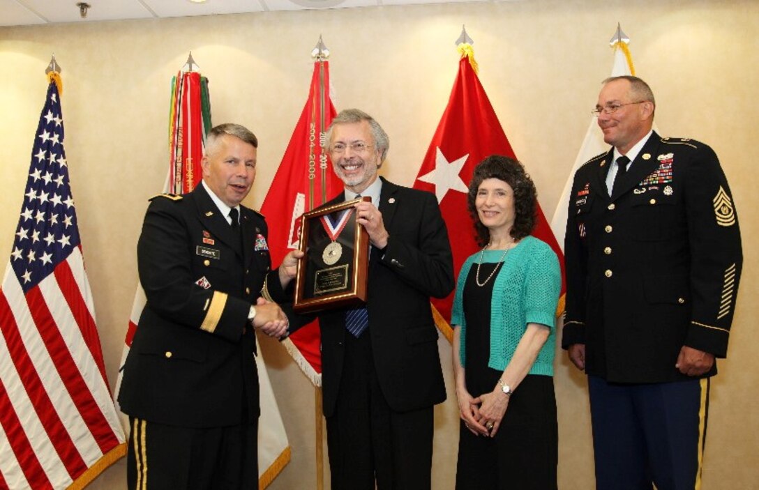 IWR and ICIWaRM Director Robert Pietrowsky accepts the 2013 LTG John W. Morris Civilian of the Year Award at the National Awards Dinner. Left to right: Maj. Gen. Todd T. Semonite, Robert A. Pietrowsky, Bob’s wife Camille Torquato, and Command Sgt. Maj. Karl J. Groninger.