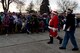 Santa Claus waves to the crowd during the annual Holiday Tree Lighting Ceremony Dec. 1, 2017, at Fairchild Air Force Base, Washington. The ceremony is an annual event that brings base community members together to enjoy holiday songs, cookies, hot chocolate and the lighting of the holiday tree. (U.S. Air Force photo/Airman Whitney Laine)