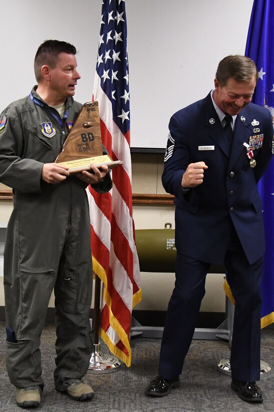 U.S. Air Force Senior Master Sgt. Darren Ellingwood, 307th Operations Support Squadron intelligence superintendent, reacts to a remark made by Lt. Col. Shawn Werchan, 307th OSS commander, during his retirement ceremony at Barksdale Air Force Base, La., Dec. 2, 2017.