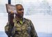 Lt. Col. Kelvin Dumas, 310th Space Operations Squadron commander, holds up the official plaque assigning a name to the new 310th OSS classroom on Friday, Dec. 1st, 2017.