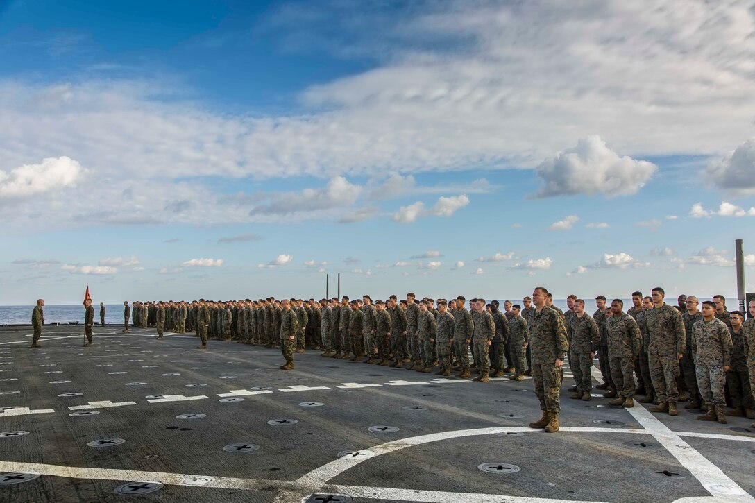 U.S. Marines with Fox Company, Battalion Landing Team, 2nd Battalion, 6th Marine Regiment, 26th Marine Expeditionary Unit (MEU), stand in formation during a promotion ceremony aboard the dock landing ship USS Oak Hill (LSD 51) in the Atlantic Ocean, Dec. 1, 2017, during Combined Composite Training Unit Exercise (COMPTUEX). Combined COMPTUEX allows all elements of the Marine Air Ground Task Force to join and train in realistic scenarios so the MEU as a whole can meet its Predeployment Training Program objectives prior to an upcoming deployment at sea. (U.S. Marine Corps photo by Staff Sgt. Dengrier M. Baez)