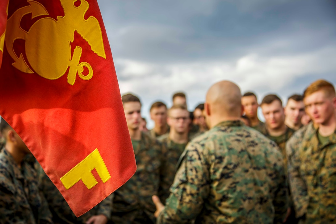 U.S. Marine Corps 1st Sgt. Christian Appleman, center, first sergeant of Fox Company, Battalion Landing Team, 2nd Battalion, 6th Marine Regiment, 26th Marine Expeditionary Unit (MEU) and senior enlisted advisor of troops aboard the dock landing ship USS Oak Hill (LSD 51), addresses Marines after a promotion ceremony aboard the Oak Hill in the Atlantic Ocean, Dec. 1, 2017, during Combined Composite Training Unit Exercise (COMPTUEX). Combined COMPTUEX allows all elements of the Marine Air Ground Task Force to join and train in realistic scenarios so the MEU as a whole can meet its Predeployment Training Program objectives prior to an upcoming deployment at sea. (U.S. Marine Corps photo by Staff Sgt. Dengrier M. Baez)