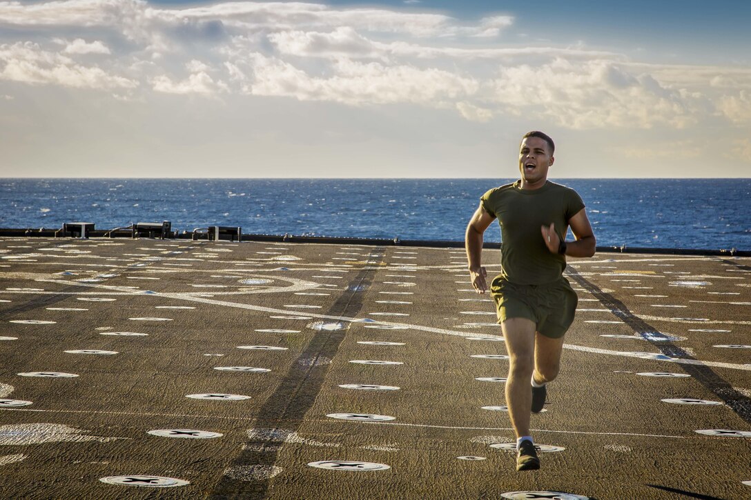 A U.S. Marine with Fox Company, Battalion Landing Team, 2nd Battalion, 6th Marine Regiment, 26th Marine Expeditionary Unit (MEU), sprints during physical training aboard the dock landing ship USS Oak Hill (LSD 51) in the Atlantic Ocean, Nov. 30, 2017. during Combined Composite Training Unit Exercise (COMPTUEX). Combined COMPTUEX allows all elements of the Marine Air Ground Task Force to join and train in realistic scenarios so the MEU as a whole can meet its Predeployment Training Program objectives prior to an upcoming deployment at sea. (U.S. Marine Corps photo by Staff Sgt. Dengrier M. Baez)