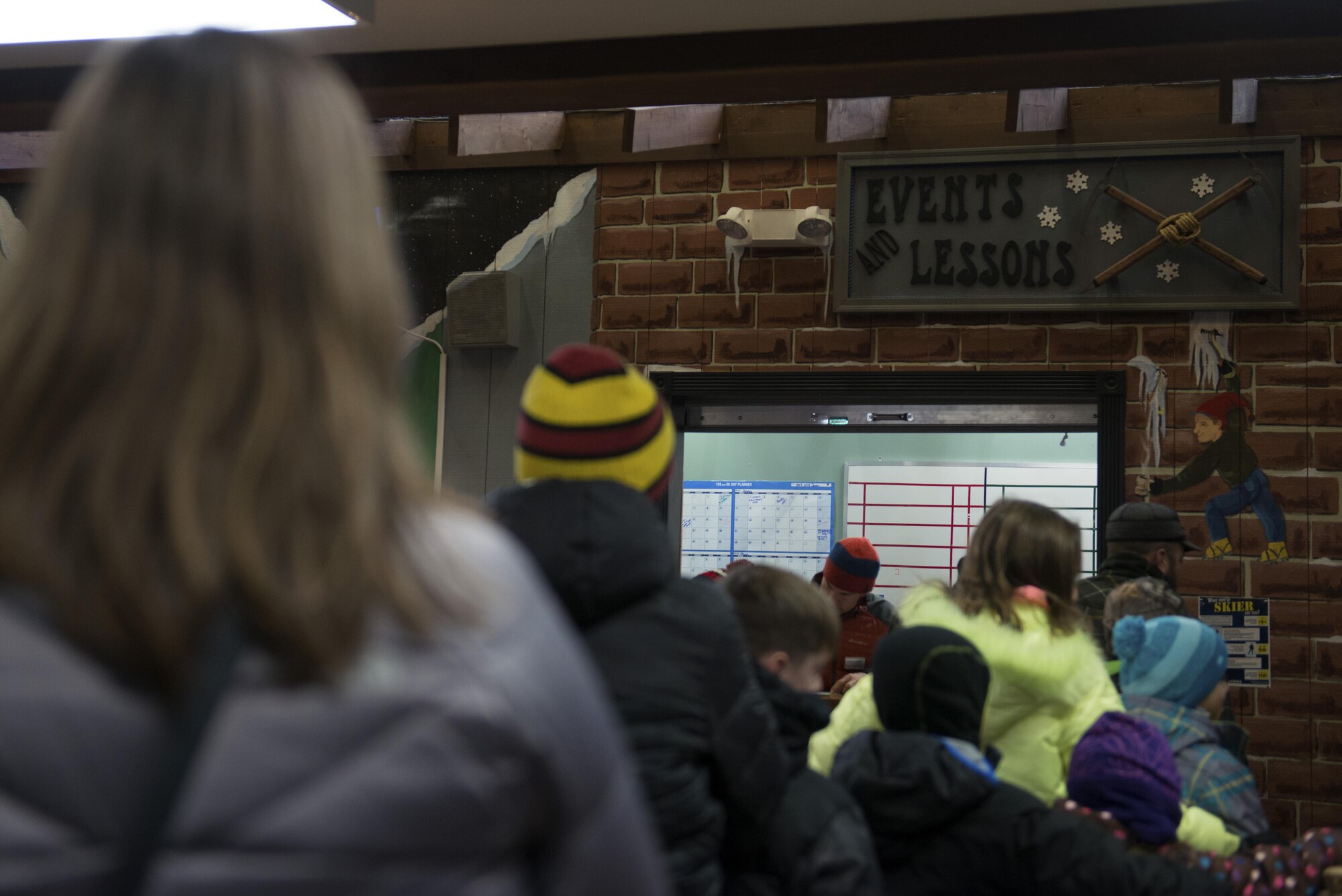 Families wait in line to sign in for the first day of ski and snowboard lessons at the Hillberg Ski Area at Joint Base Elmendorf-Richardson, Alaska, Dec. 1, 2017. Hillberg created their own snow and provided skiers and snowboarders a dual chairlift, sledding tow and handle tow.