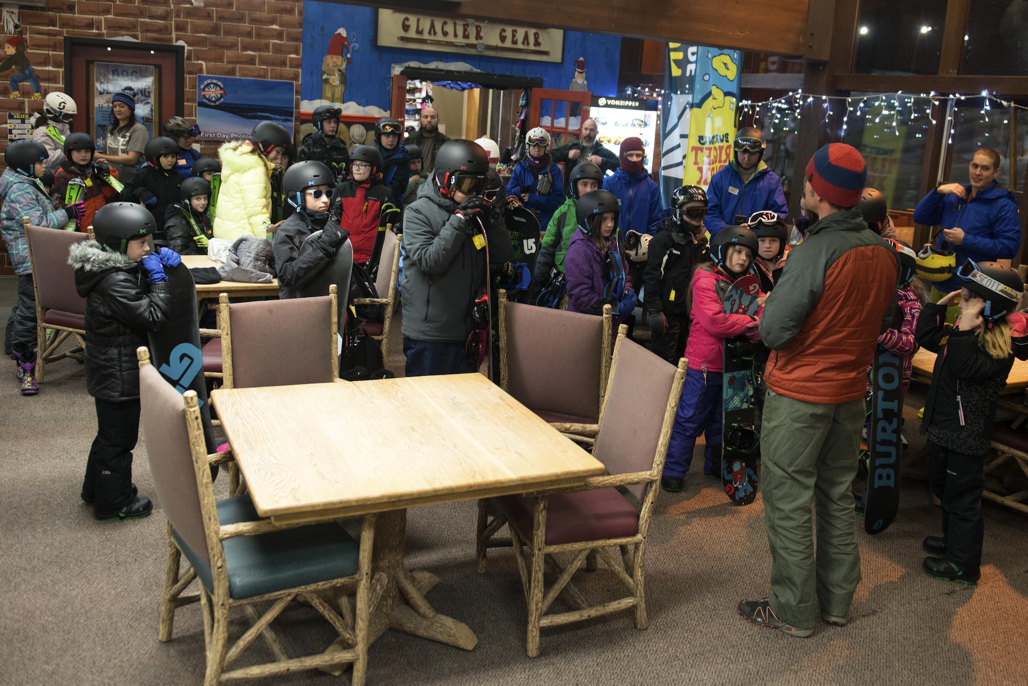 Karl Lavtar, Outdoor Adventure Program lead, instructs children at the Hillberg Ski Area before their first day of youth snow sports lessons at Joint Base Elmendorf-Richardson, Alaska, Dec. 1, 2017. The Kennecott Youth Center and Hillberg partnered up to provide children transportation to and from each facility, equipment rentals, and two-hour instruction on how to ski or snowboard.