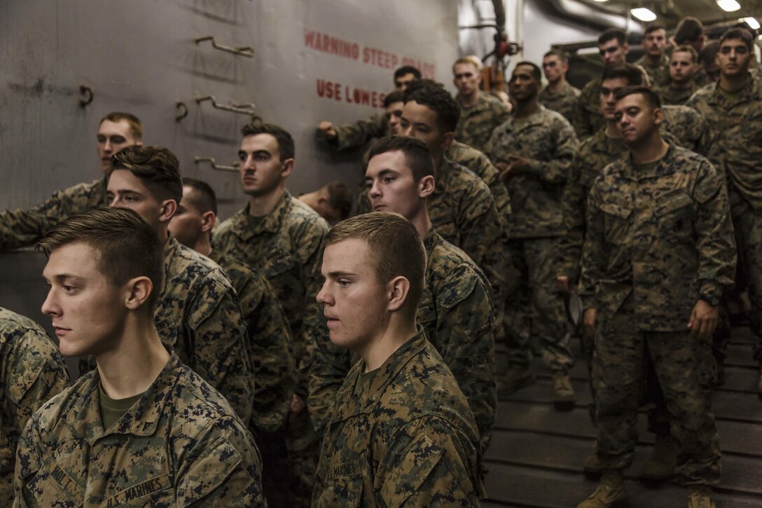 U.S. Marines and Sailors with Fox Company, Battalion Landing Team, 2nd Battalion, 6th Marine Regiment, 26th Marine Expeditionary Unit (MEU), line up during a call away, an accountability and boarding procedures rehearsal, at the well deck of the dock landing ship USS Oak Hill (LSD 51) in Atlantic Ocean Nov. 28, 2017, as part of Combined Composite Training Unit Exercise (COMPTUEX). Combined COMPTUEX allows all elements of the Marine Air Ground Task Force to join and train in realistic scenarios so the MEU as a whole can meet its Predeployment Training Program objectives prior to an upcoming deployment at sea. (U.S. Marine Corps photo by Staff Sgt. Dengrier M. Baez)