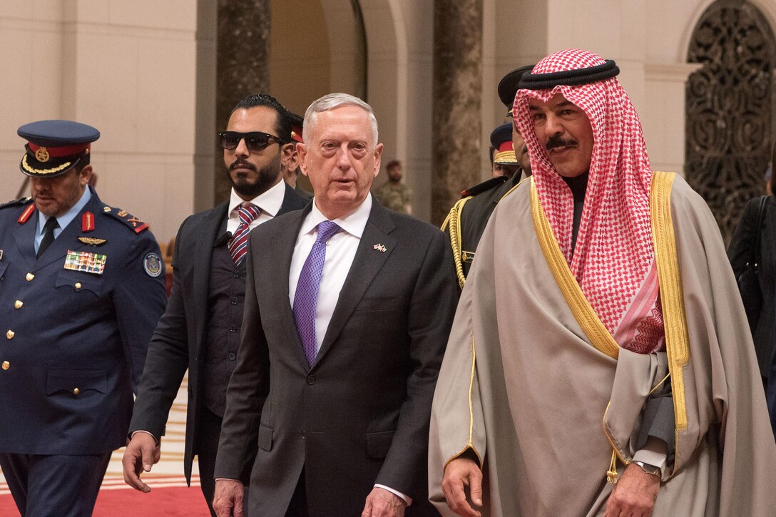 Defense Secretary walks alongside the Emir of Kuwait