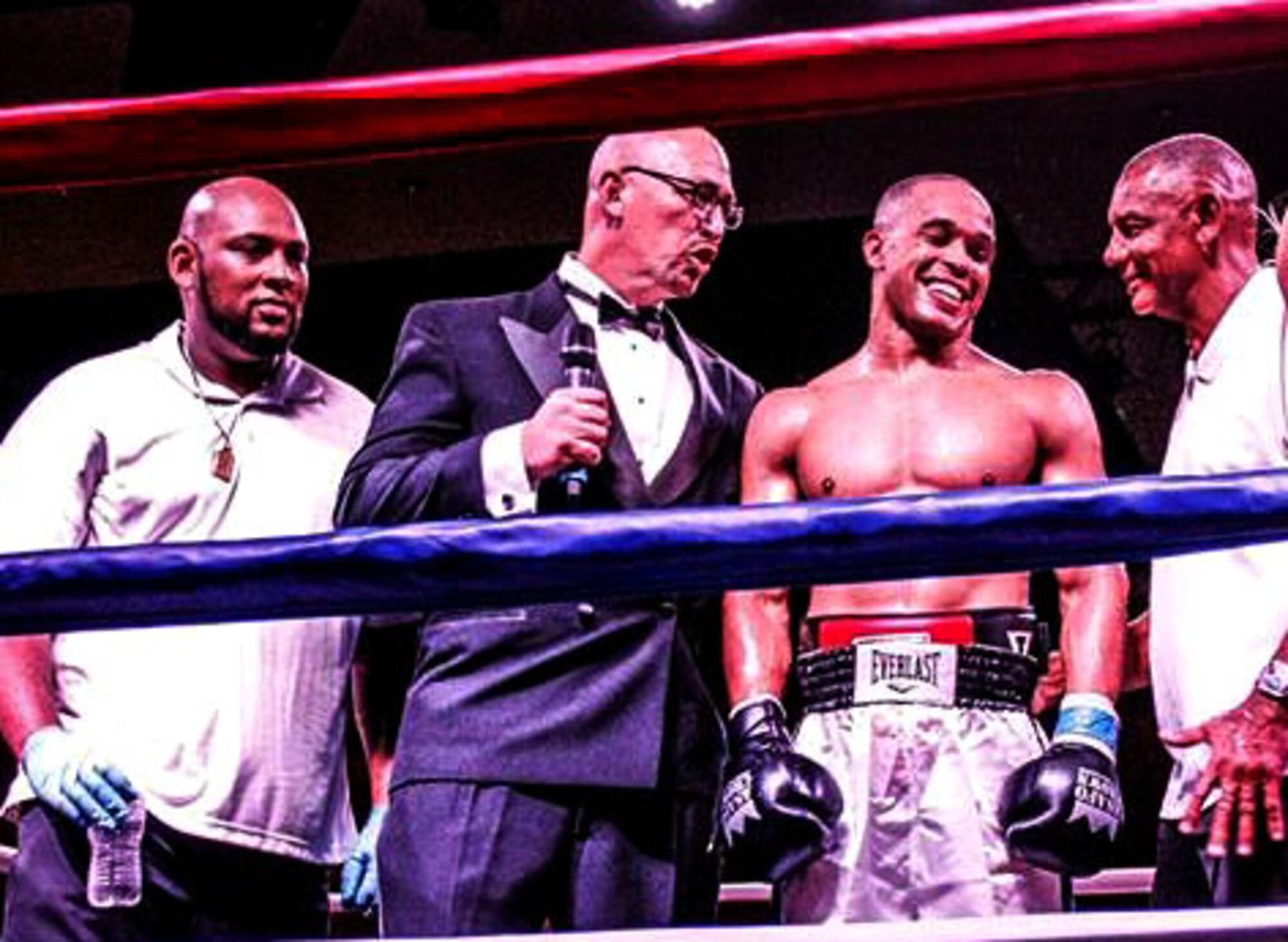 U.S. Air Force Tech. Sgt. Andre Penn, 20th Civil Engineer Squadron unaccompanied housing manager, center right, is congratulated following his boxing match win at the “Battle in the Panhandle,” in Fort Walton Beach, Florida, Nov. 18, 2017.