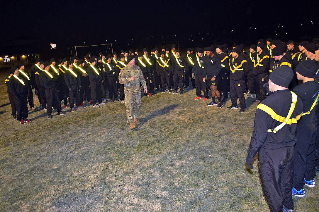 Soldiers receive a training brief before participating in the morning physical training.