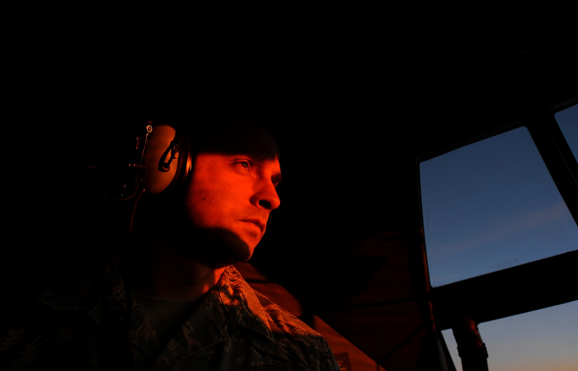 U.S. Air Force Master Sgt. Caleb Thorne, 86th Aircraft Maintenance Squadron productions superintendent, watches the sunrise over Shannon, Ireland, from a C-130J Super Hercules Dec. 4, 2017. The crew traveled across three countries and three states within the U.S. in one week to pick-up Ramstein’s new aircraft from Lockheed Martin Aeronautics Company production facility headquarters in Marietta, Georgia. (U.S. Air Force photo by Airman 1st Class Savannah L. Waters)