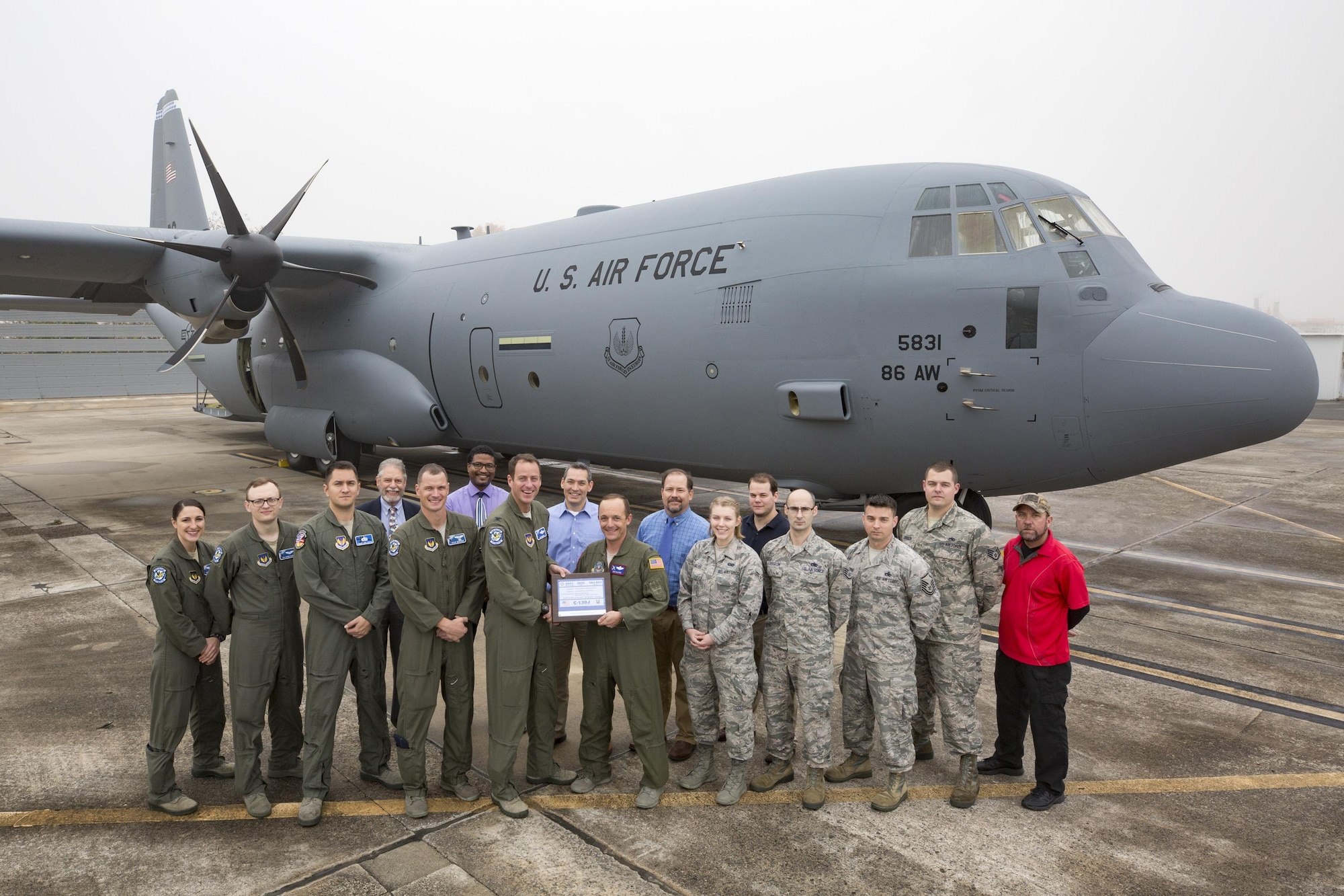 Lockheed Martin Aeronautics Company turns over the keys to the newest C130J in the 37th Airlift Squadron fleet to the team from Ramstein. Part of a concept, according to Air Mobility Command, called “Enterprise Fleet Management”, the new aircraft replaces a C-130J that was transferred to Yokota Air Base. (Courtesy photo, Lockheed Martin Aeronautics Company)