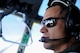 U.S. Air Force Maj. Kyle Bucher, 37th Airlift Squadron C-130J Super Hercules pilot, looks out while flying a C-130J to Dyess Air Force Base, Texas, Nov. 29, 2017. The C-130J, an upgraded version of the C-130 Hercules legacy model, adds 15 feet to the fuselage and increases usable space in the cargo compartment. The new aircraft replaces one of 14 C-130J’s in Ramstein’s fleet, helping avoid potential problems with the Air Force’s aging fleet. (U.S. Air Force photo by Airman 1st Class Savannah L. Waters)