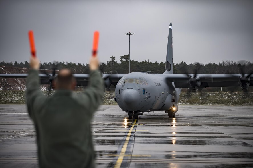 U.S. Air Force Col. Joseph H. Wenckus, 86th Airlift Wing vice commander, taxies a C-130J Super Hercules to its place on the flightline on Ramstein Air Base, Germany, Dec. 4, 2017. The new aircraft was flown from the Lockheed Martin Aeronautics Company in Marietta, Georgia, and delivered to the 37th Airlift Squadron at Ramstein. (U.S. Air Force photo by Senior Airman Devin Boyer)