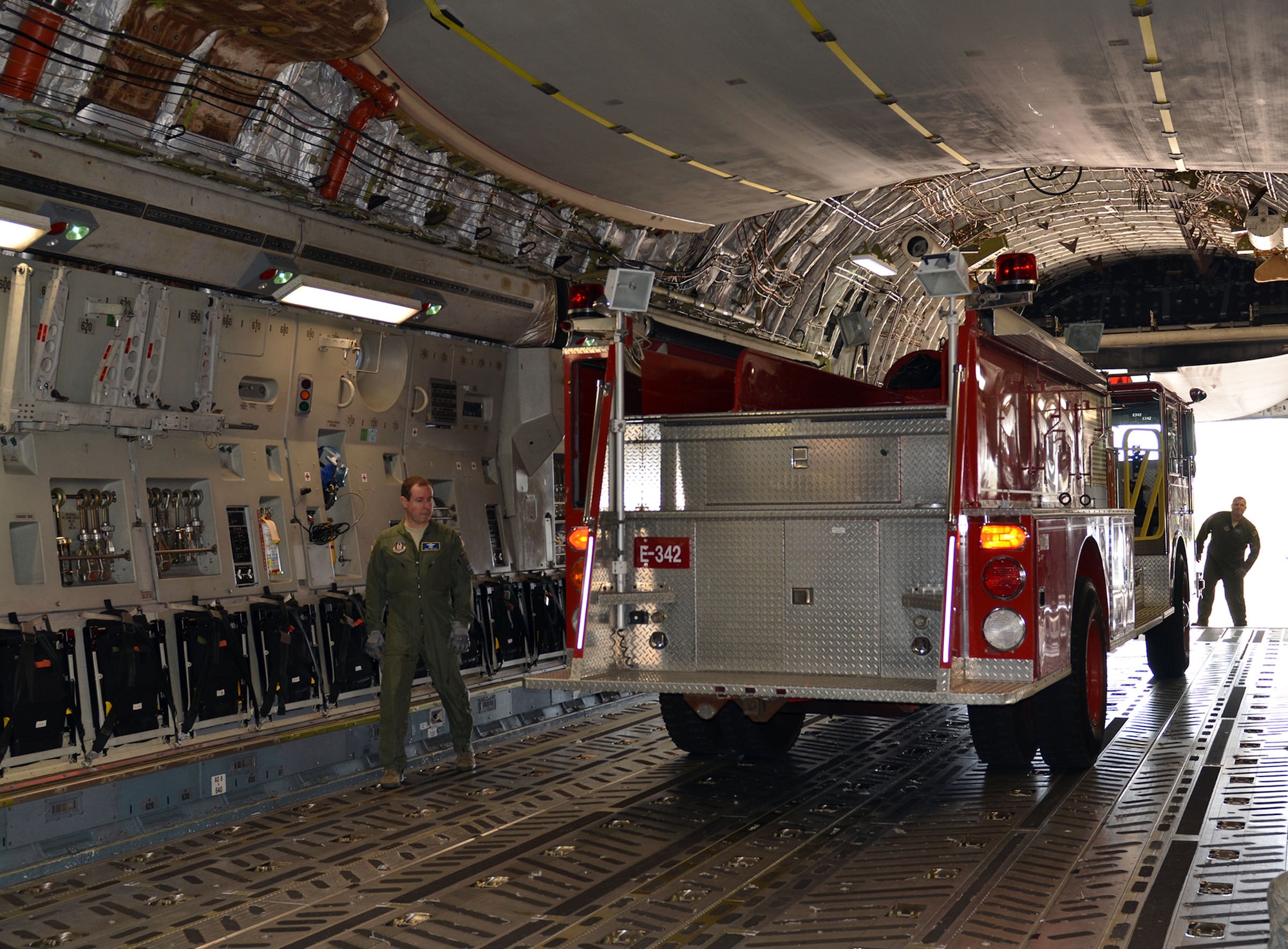 Loadmasters from the 89th Airlift Squadron load a fire truck on a 445th Airlift Wing C-17 Globemaster III Nov. 8, 2017. The wing received a request through the Denton Program to move a fire truck from Ohio to Belize City, Belize.