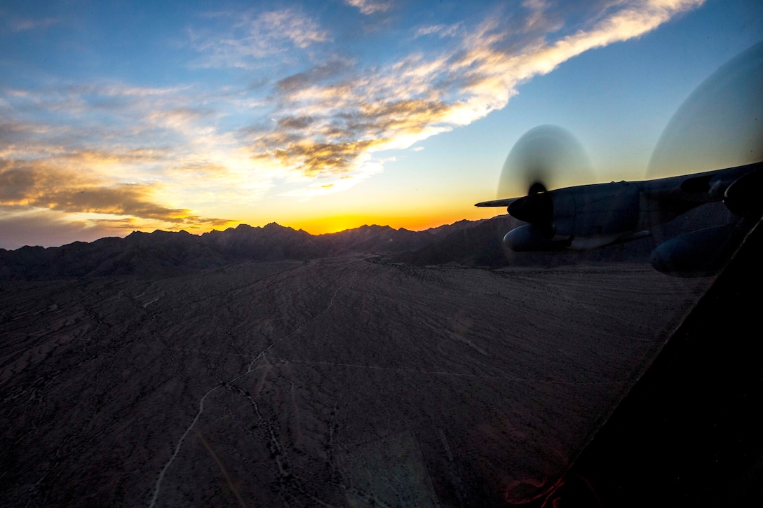 A Marine Corps KC130-J Hercules aircraft conducts a threat reaction exercise during unit-level tactical navigation training.