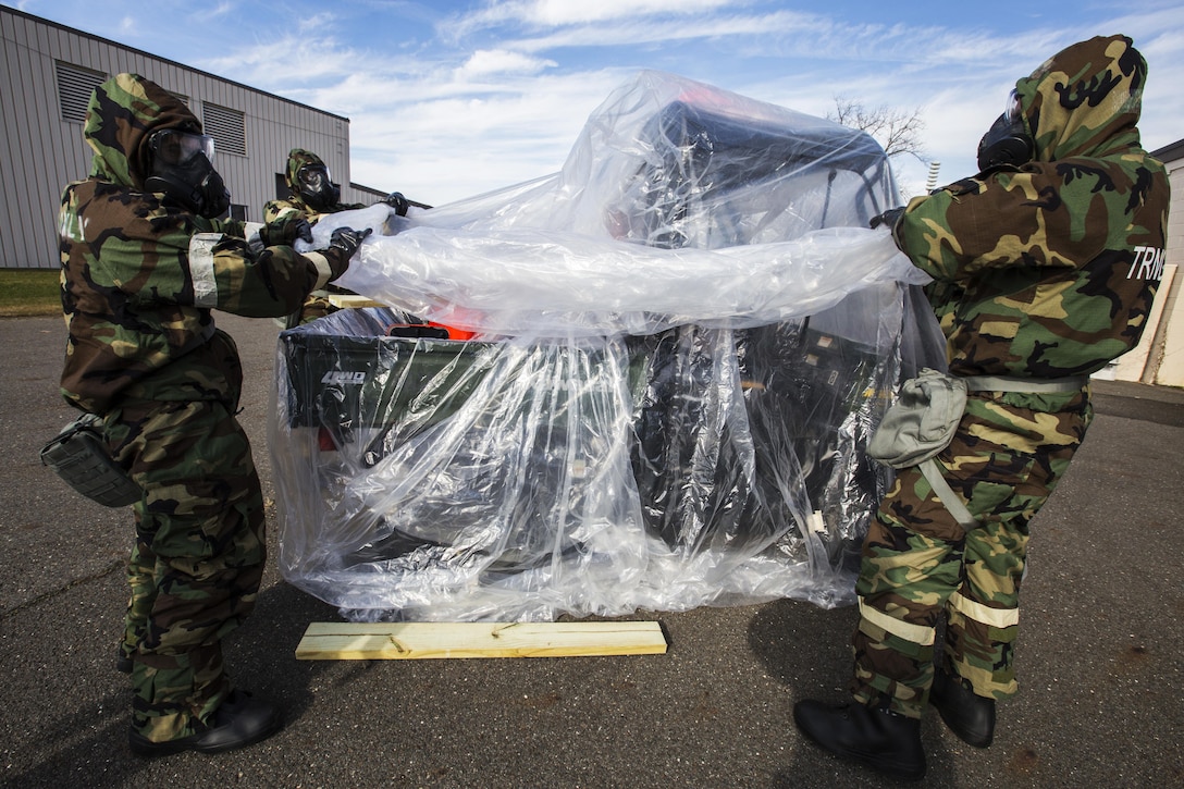 Airmen cover vehicle during training