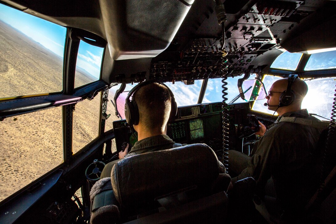 1st Lt. Eric Brown, left, and Capt. Brian Kursawe conduct tactical navigation during unit-level training.