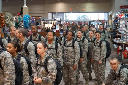 Air Force basic trainees from Joint Base San Antonio-Lackland wait to be admitted to the JBSA-Lackland Base Exchange Dec. 2 to do some early shopping. About 3,800 trainees were treated to holiday cheer Dec. 2 at the Lackland Exchange, which opened extra early just for them. Typically, trainees are not allowed to visit the Exchange or do much beyond their rigorous assignments.