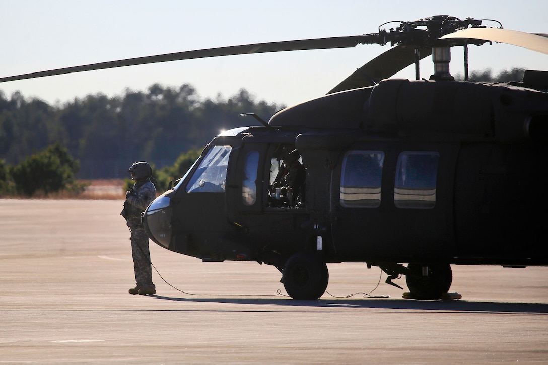 A New Jersey Army National Guardsman prepares a UH-60 Black Hawk helicopter before a training exercise.