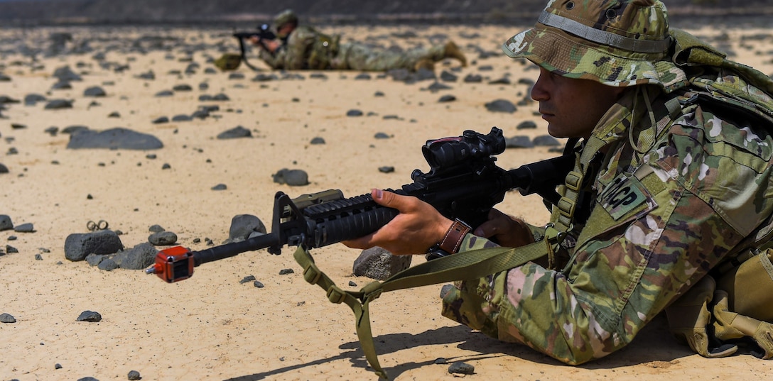 Soldiers assigned to Combined Joint Task Force Horn of Africa keep watch as their platoon sets up an objective rally point on the first day of a French Desert Commando Course at the Djibouti Range Complex near Arta, Djibouti.