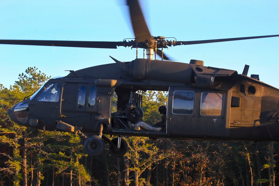 An Army UH-60 Black Hawk helicopter takes off before participating in a slingload training exercise.